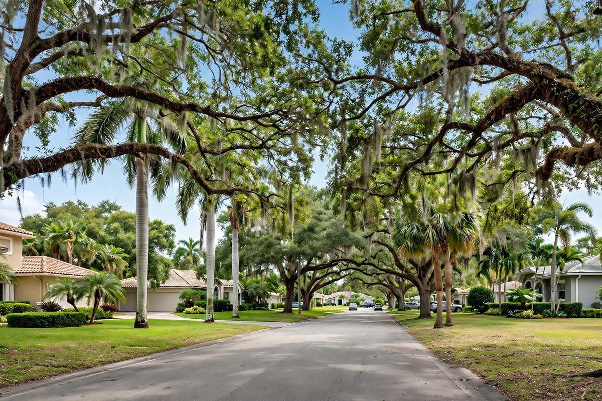 A photorealistic view of an upscale residential street in Kendall, Pinecrest West, Miami, Florida, lined with ranch homes and mature landscaping on a clear day.